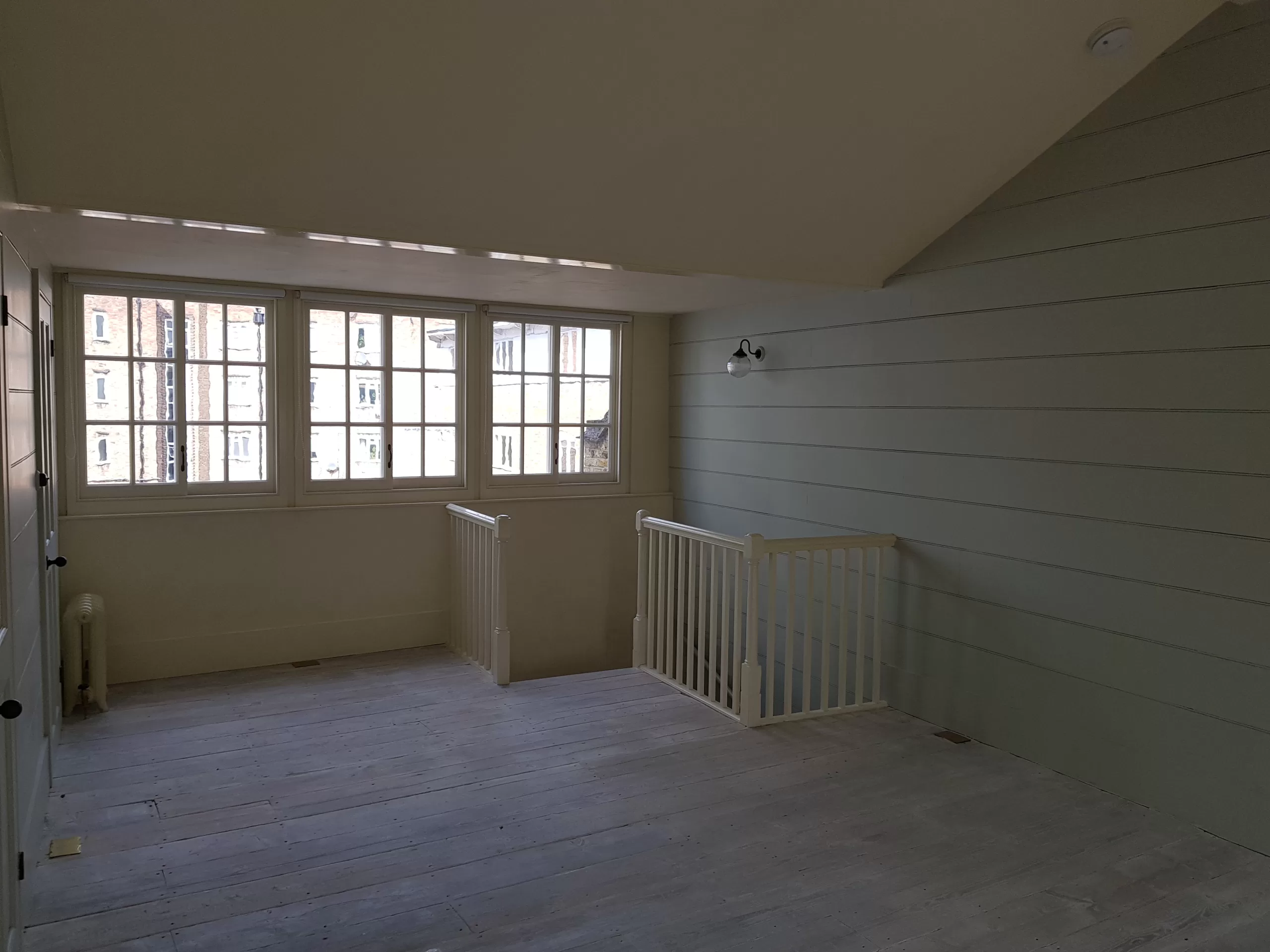 Loft extension with Yorkshire windows. Original Georgian handrails from floor below to right hand side.