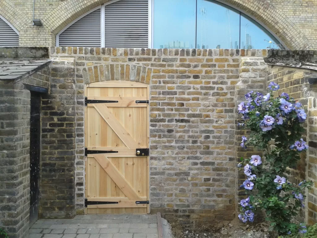 Lime mortar built wall with gate.